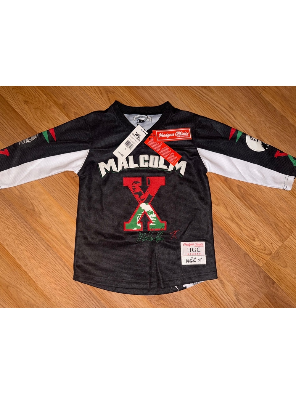 $85 YOUTH SMALL-MALCOLM X BLACK HOCKEY JERSEY
